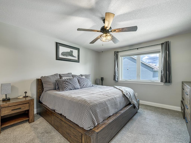 6937 94th St S, Cottage Grove, MN 55016 - bedroom featuring carpet floors, a textured ceiling, and a ceiling fan