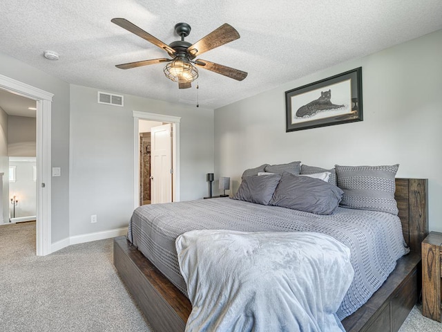 6937 94th St S, Cottage Grove, MN 55016 - carpeted bedroom featuring a textured ceiling and a ceiling fan