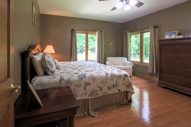21601 Timber Hills Trl, Nisswa, MN 56468 - bedroom with light wood-style flooring and ceiling fan