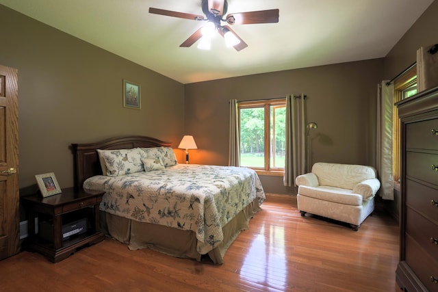 21601 Timber Hills Trl, Nisswa, MN 56468 - bedroom with wood finished floors and a ceiling fan