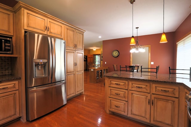 21601 Timber Hills Trl, Nisswa, MN 56468 - kitchen with appliances with stainless steel finishes, dark wood-style flooring, plenty of natural light, hanging light fixtures, and recessed lighting