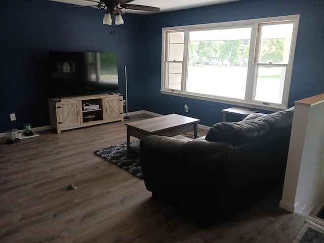 1235 Mitchell Pl, Fergus Falls, MN 56537 - living room featuring ceiling fan and dark wood-style flooring