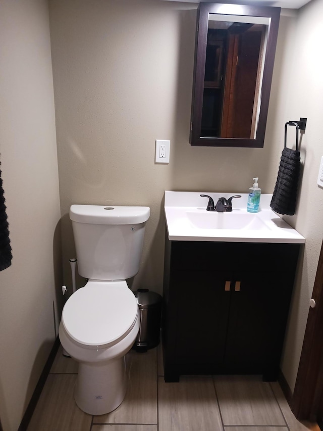 1235 Mitchell Pl, Fergus Falls, MN 56537 - half bathroom with vanity and wood finished floors