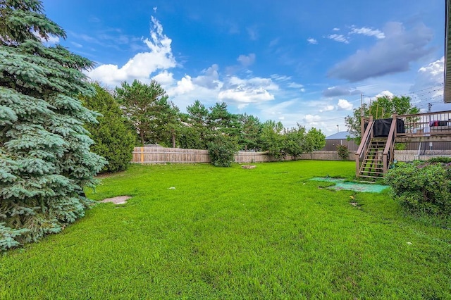 1301 English Ave NW, New Prague, MN 56071 - fenced backyard featuring stairs and a deck