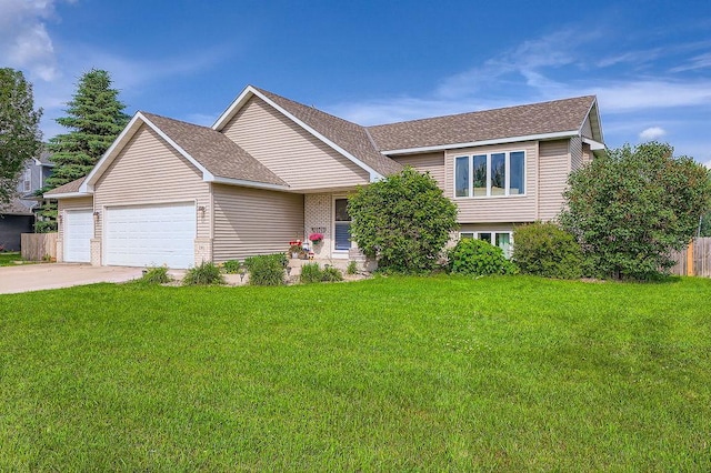 1301 English Ave NW, New Prague, MN 56071 - view of front of home with an attached garage, driveway, and roof with shingles
