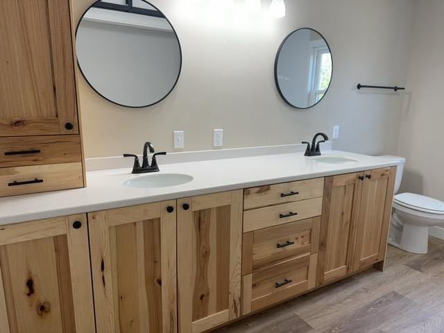 20 Erie St, Aurora, MN 55705 - bathroom with double vanity and wood finished floors