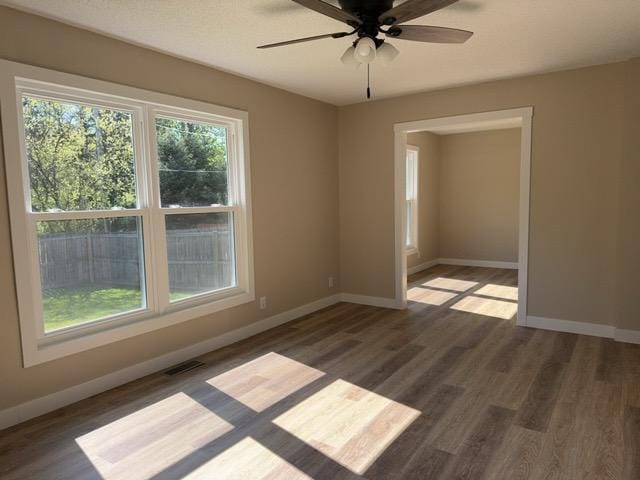 20 Erie St, Aurora, MN 55705 - unfurnished room with wood finished floors and ceiling fan