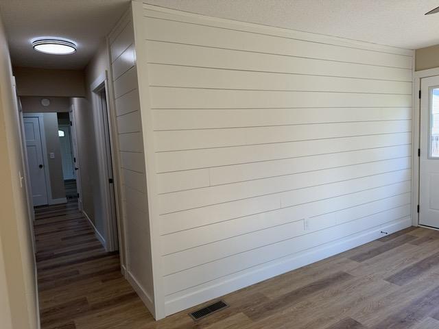 20 Erie St, Aurora, MN 55705 - hallway with dark wood-type flooring
