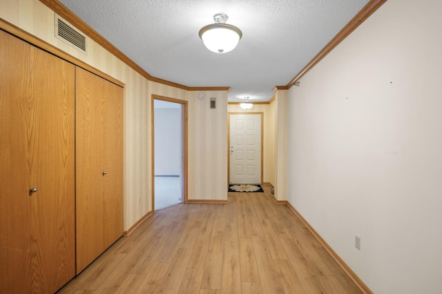 5011 Lake Ave Unit 105, White Bear Lake, MN 55110 - corridor with ornamental molding, a textured ceiling, and light wood-style floors