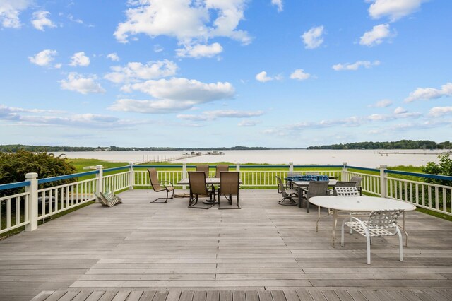 5011 Lake Ave Unit 105, White Bear Lake, MN 55110 - wooden terrace featuring outdoor dining space and a water view