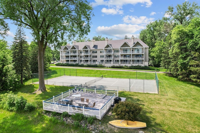 5011 Lake Ave Unit 105, White Bear Lake, MN 55110 - back of property with a tennis court and a chimney