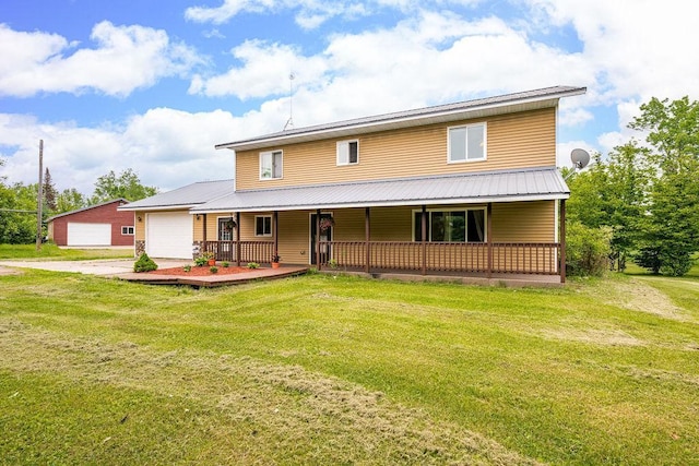 4984 Tower Rd, Moose Lake, MN 55767 - farmhouse with covered porch, concrete driveway, a front lawn, a metal roof, and an attached garage