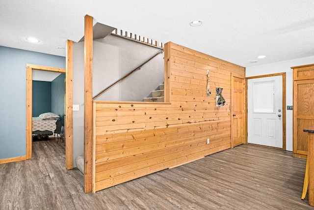 4984 Tower Rd, Moose Lake, MN 55767 - entryway featuring wood finished floors, a textured ceiling, recessed lighting, and wood walls