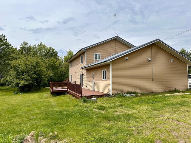 4984 Tower Rd, Moose Lake, MN 55767 - rear view of property featuring a deck and a lawn