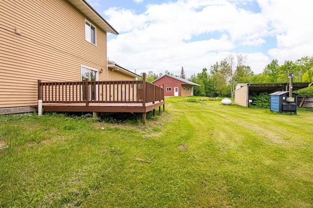 4984 Tower Rd, Moose Lake, MN 55767 - view of green lawn featuring a deck