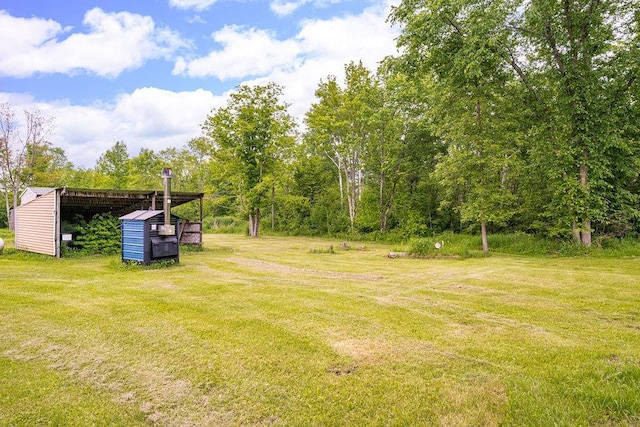 4984 Tower Rd, Moose Lake, MN 55767 - view of green lawn with an outbuilding and a pole building