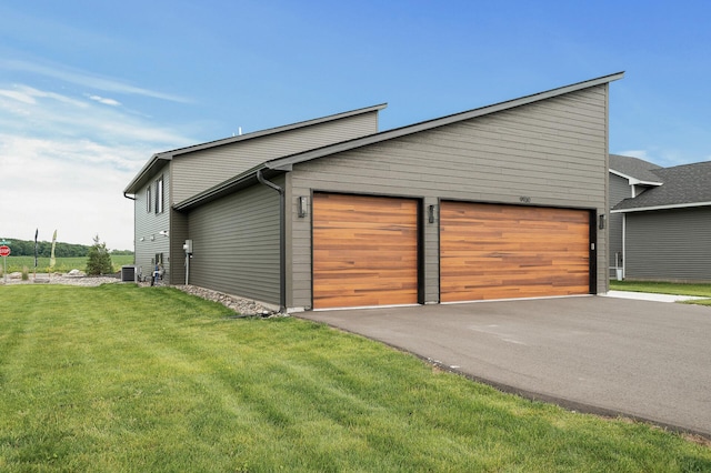 9930 14th Cir NE, Saint Michael, MN 55376 - view of property exterior with a lawn and a garage