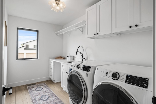 9930 14th Cir NE, Saint Michael, MN 55376 - laundry area with separate washer and dryer, cabinet space, and light wood finished floors