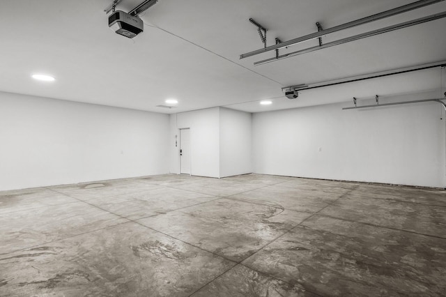 9930 14th Cir NE, Saint Michael, MN 55376 - garage featuring a garage door opener and recessed lighting