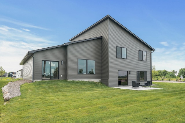 9930 14th Cir NE, Saint Michael, MN 55376 - rear view of property with a patio area and a lawn