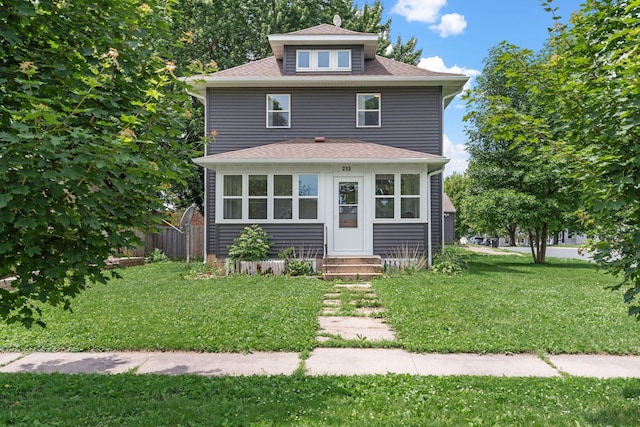 213 2nd St NE, Grand Meadow, MN 55936 - american foursquare style home with entry steps, a front yard, and a shingled roof
