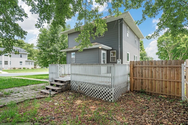 213 2nd St NE, Grand Meadow, MN 55936 - rear view of property featuring a wooden deck