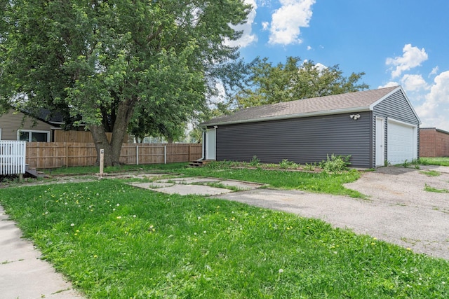 213 2nd St NE, Grand Meadow, MN 55936 - view of yard with a detached garage and an outdoor structure