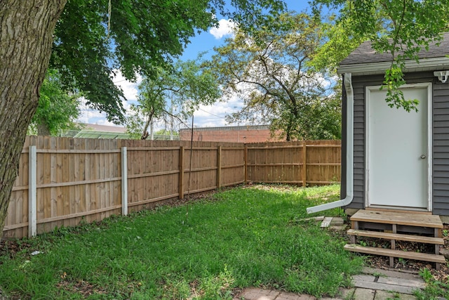213 2nd St NE, Grand Meadow, MN 55936 - fenced backyard with an outbuilding