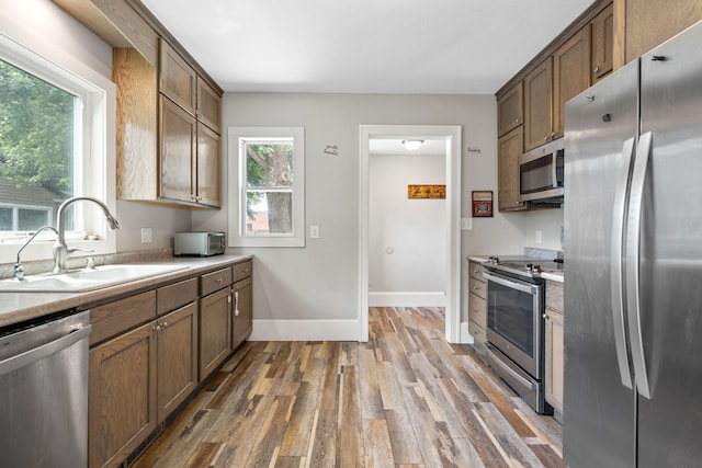 213 2nd St NE, Grand Meadow, MN 55936 - kitchen featuring stainless steel appliances, wood finished floors, and light countertops