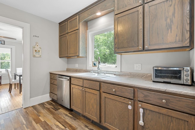 213 2nd St NE, Grand Meadow, MN 55936 - kitchen with stainless steel dishwasher, dark wood-type flooring, and light countertops
