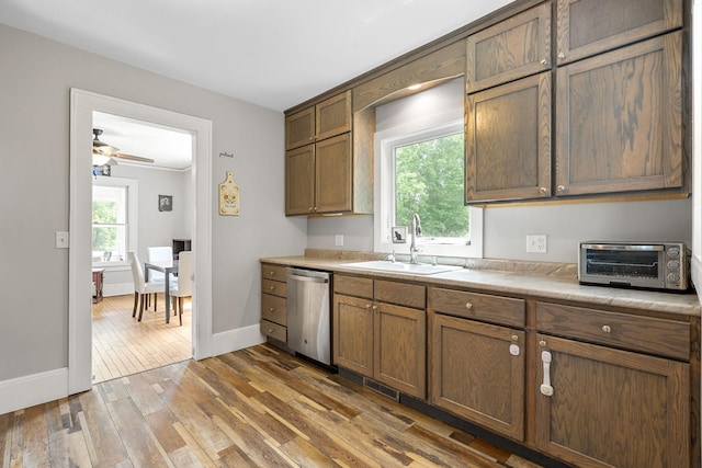 213 2nd St NE, Grand Meadow, MN 55936 - kitchen with dishwasher, light wood-type flooring, light countertops, and a ceiling fan