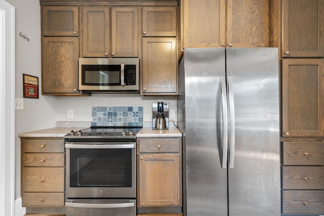 213 2nd St NE, Grand Meadow, MN 55936 - kitchen featuring appliances with stainless steel finishes and light countertops
