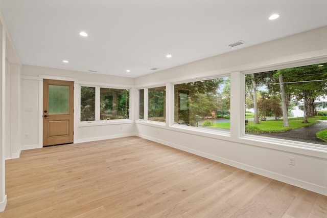 2022 Lake Rd, Minnetonka Beach, MN 55391 - unfurnished sunroom featuring wood finished floors and recessed lighting
