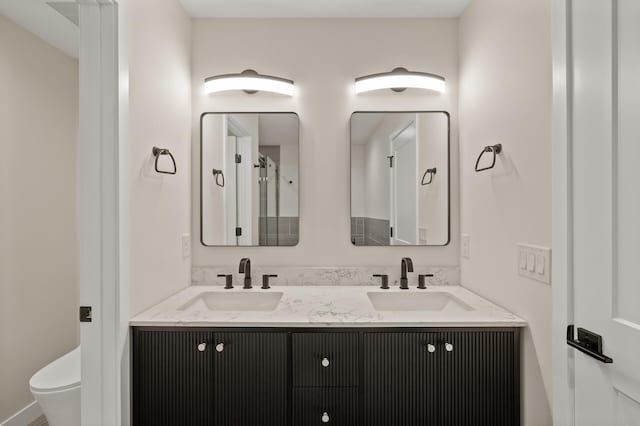 2022 Lake Rd, Minnetonka Beach, MN 55391 - bathroom featuring double vanity and toilet