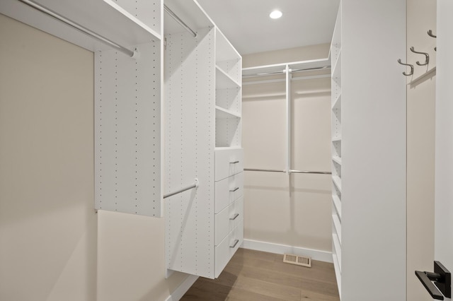 2022 Lake Rd, Minnetonka Beach, MN 55391 - walk in closet featuring wood finished floors