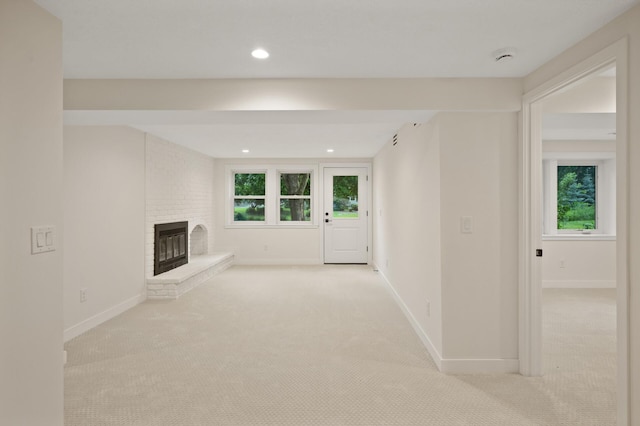 2022 Lake Rd, Minnetonka Beach, MN 55391 - unfurnished living room with carpet floors, a fireplace, and recessed lighting