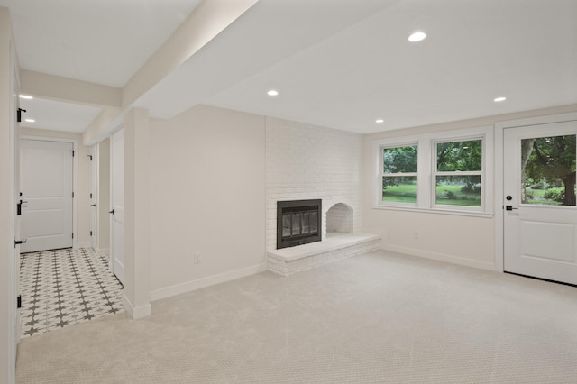 2022 Lake Rd, Minnetonka Beach, MN 55391 - unfurnished living room featuring a brick fireplace, carpet floors, and recessed lighting