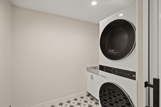 2022 Lake Rd, Minnetonka Beach, MN 55391 - washroom with estacked washer and dryer, cabinet space, light floors, and recessed lighting