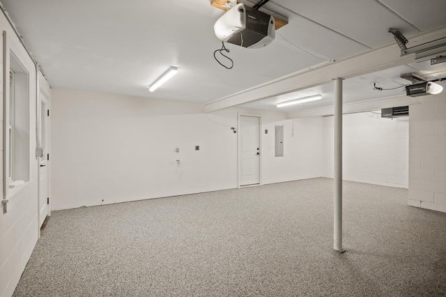 2022 Lake Rd, Minnetonka Beach, MN 55391 - garage with a garage door opener, concrete block wall, and electric panel