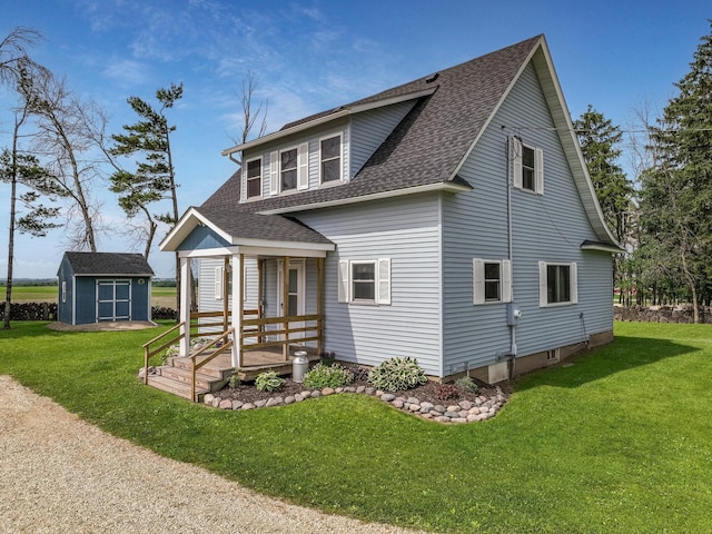 N2498 50th St, Union Twp, WI 54761 - view of front of house with a shingled roof, a front lawn, covered porch, and a storage unit