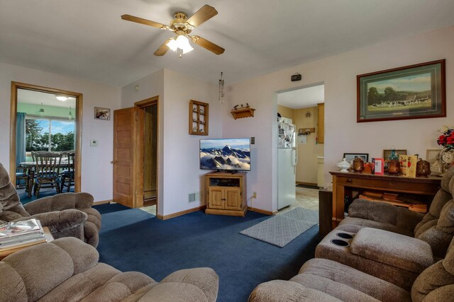 N2498 50th St, Union Twp, WI 54761 - carpeted living room with a ceiling fan and baseboards