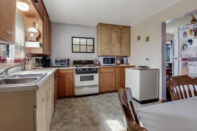 N2498 50th St, Union Twp, WI 54761 - kitchen featuring white appliances, light countertops, and brown cabinetry