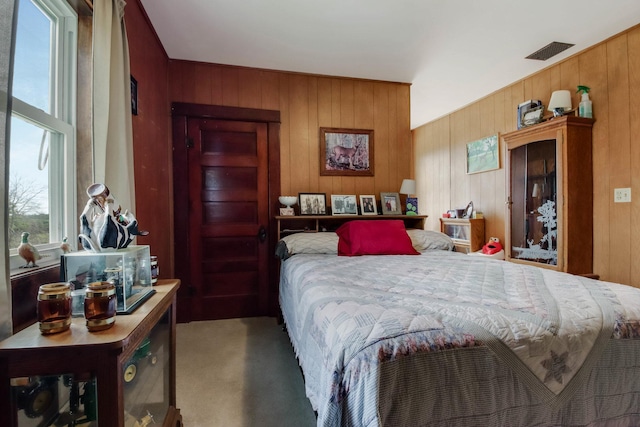 N2498 50th St, Union Twp, WI 54761 - carpeted bedroom featuring wood walls