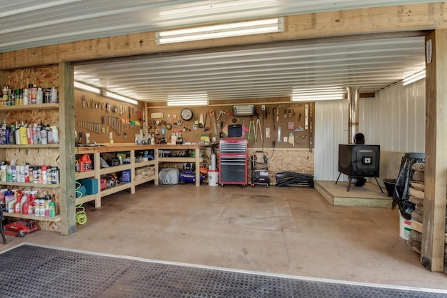 N2498 50th St, Union Twp, WI 54761 - garage with a wood stove