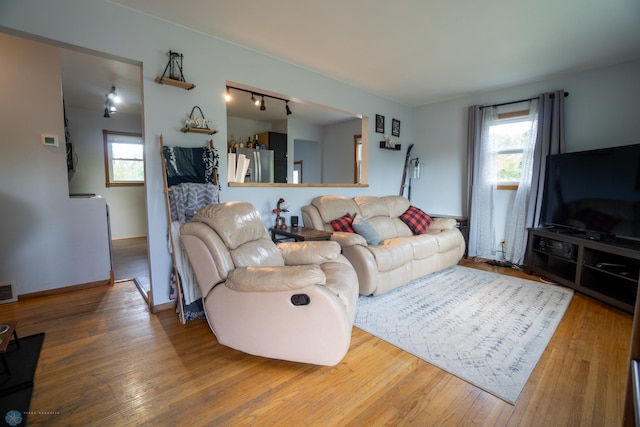 2901 10th Ave N, Fargo, ND 58102 - living room featuring wood finished floors and rail lighting