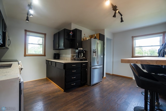 2901 10th Ave N, Fargo, ND 58102 - kitchen with track lighting, appliances with stainless steel finishes, dark wood-style flooring, light countertops, and plenty of natural light