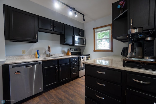 2901 10th Ave N, Fargo, ND 58102 - kitchen featuring stainless steel appliances, dark cabinets, dark wood-style floors, open shelves, and light stone countertops