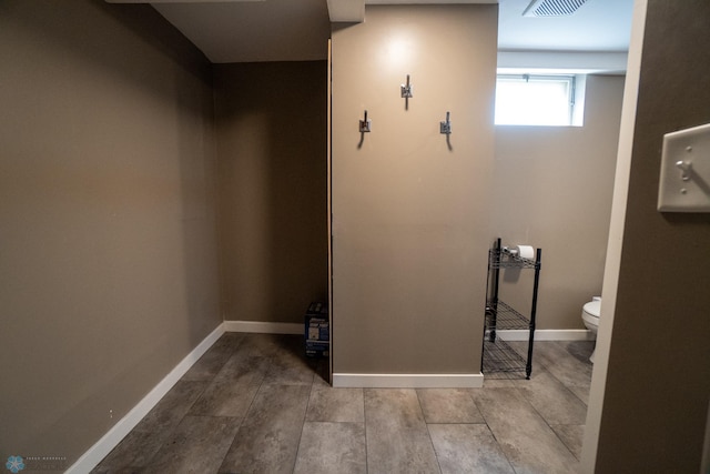 2901 10th Ave N, Fargo, ND 58102 - bathroom featuring toilet and baseboards