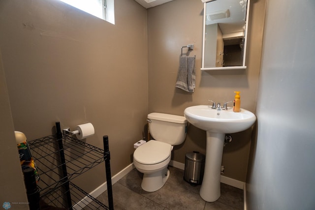 2901 10th Ave N, Fargo, ND 58102 - half bathroom with toilet and tile patterned floors