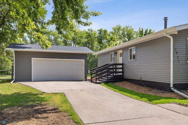 1031 7th St W, West Fargo, ND 58078 - ranch-style house featuring an outdoor structure and a garage